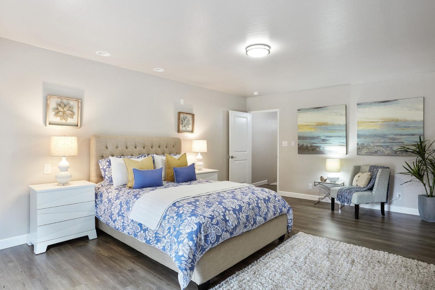 1015 Sycamore Drive Millbrae, CA 94030 - Photo 10 of 26 a bedroom with a bed and a table in it