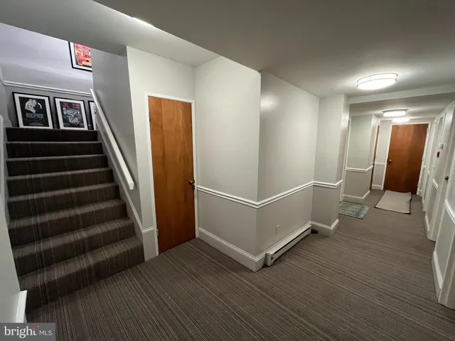 a view of a hallway with staircase