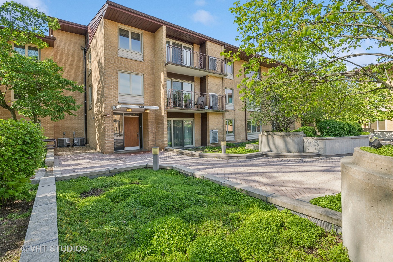 2400 West Talcott Road, Unit 121 Park Ridge, IL 60068 - Photo 1 of 10 a view of a building with a yard