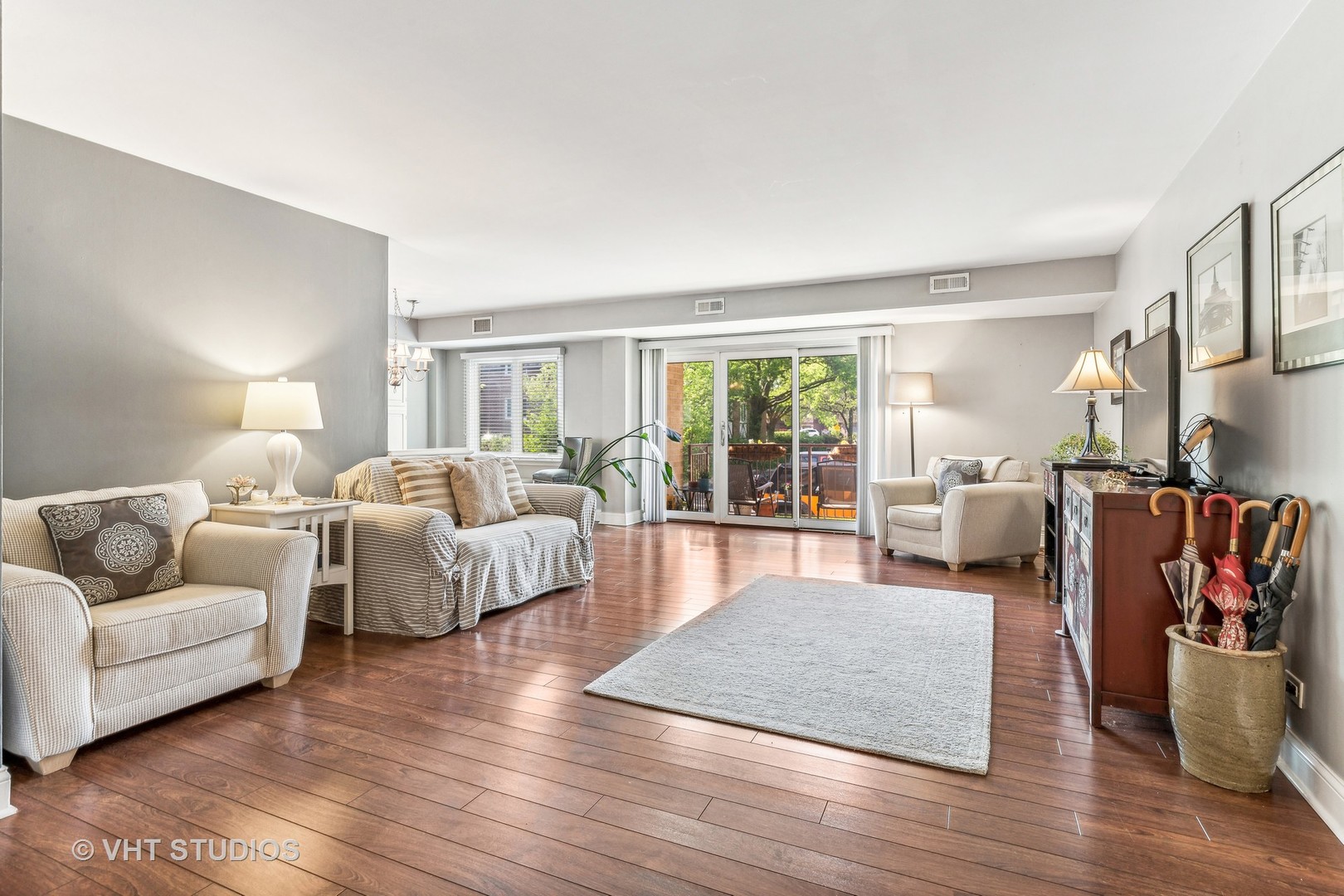 2400 West Talcott Road, Unit 121 Park Ridge, IL 60068 - Photo 2 of 10 a living room with furniture and a large window