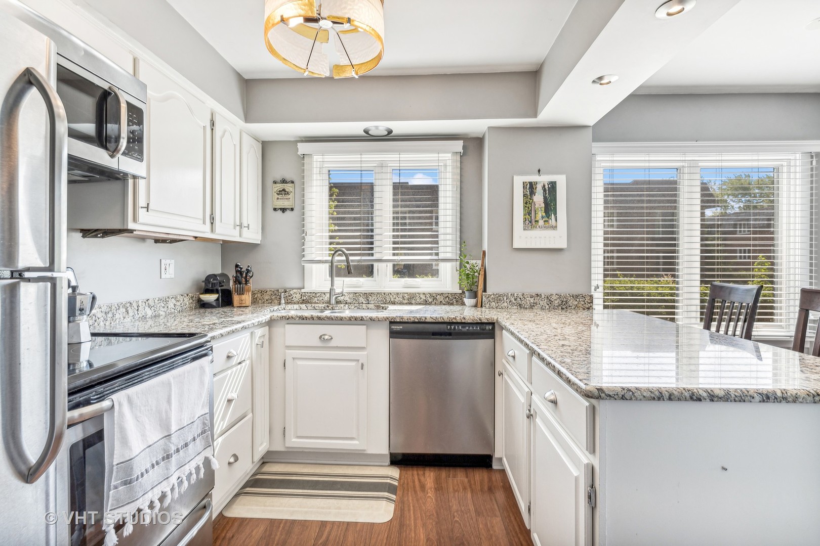 2400 West Talcott Road, Unit 121 Park Ridge, IL 60068 - Photo 5 of 10 a kitchen with granite countertop stainless steel appliances a sink and cabinets