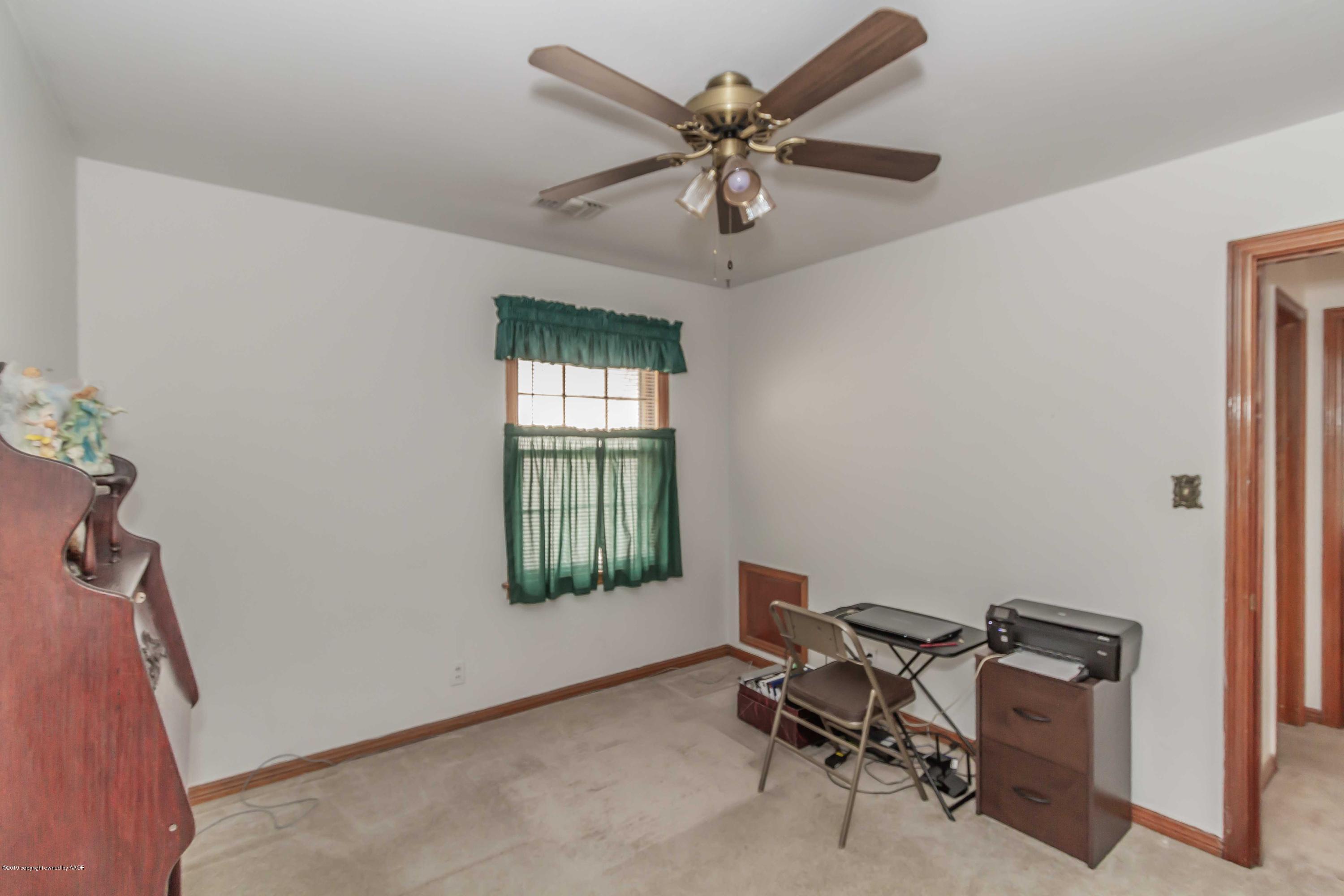 3613 Cline Road Amarillo, TX 79110 - Photo 24 of 36 a view of a workspace with furniture and a window