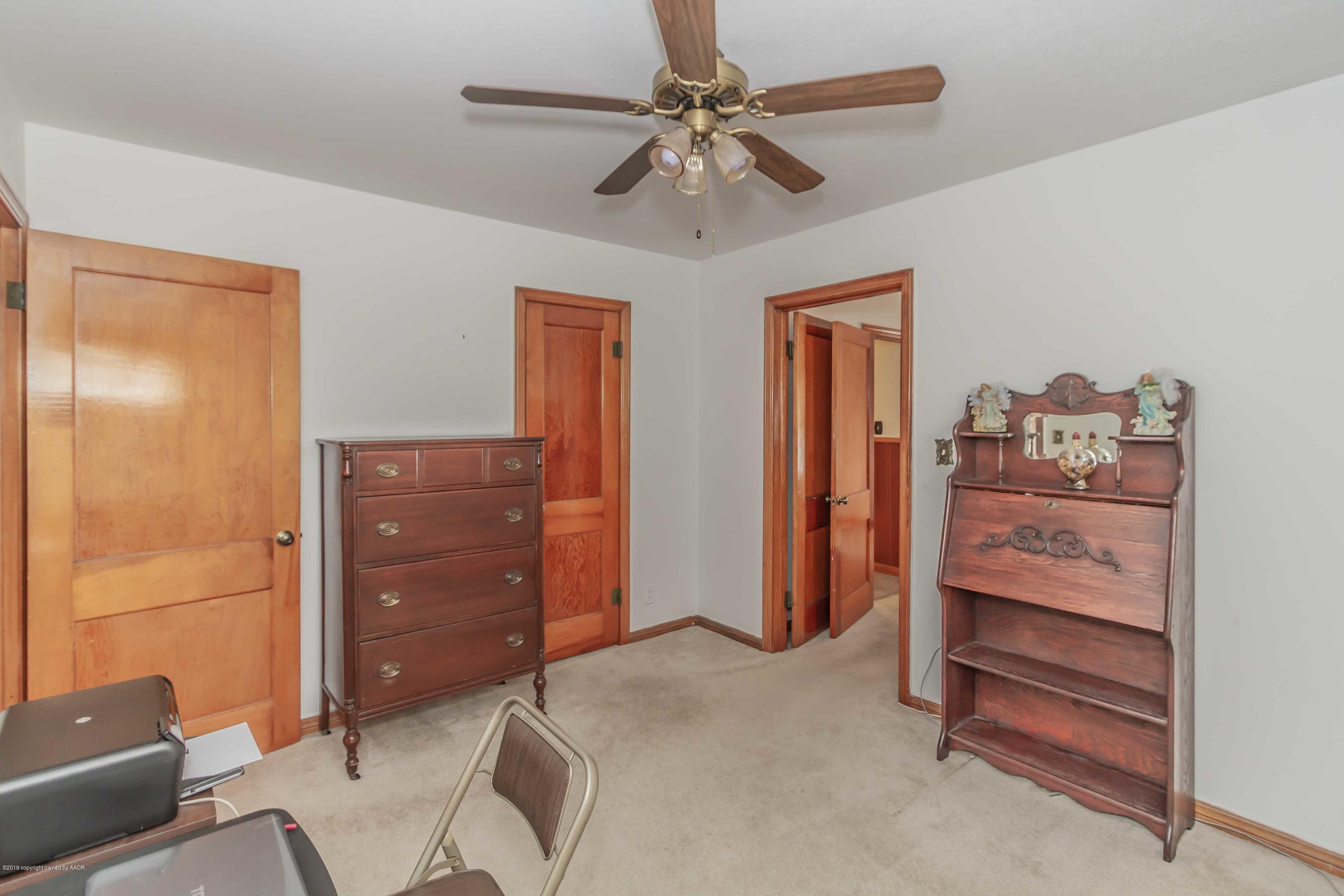 3613 Cline Road Amarillo, TX 79110 - Photo 26 of 36 a bed room with a bed and a dresser