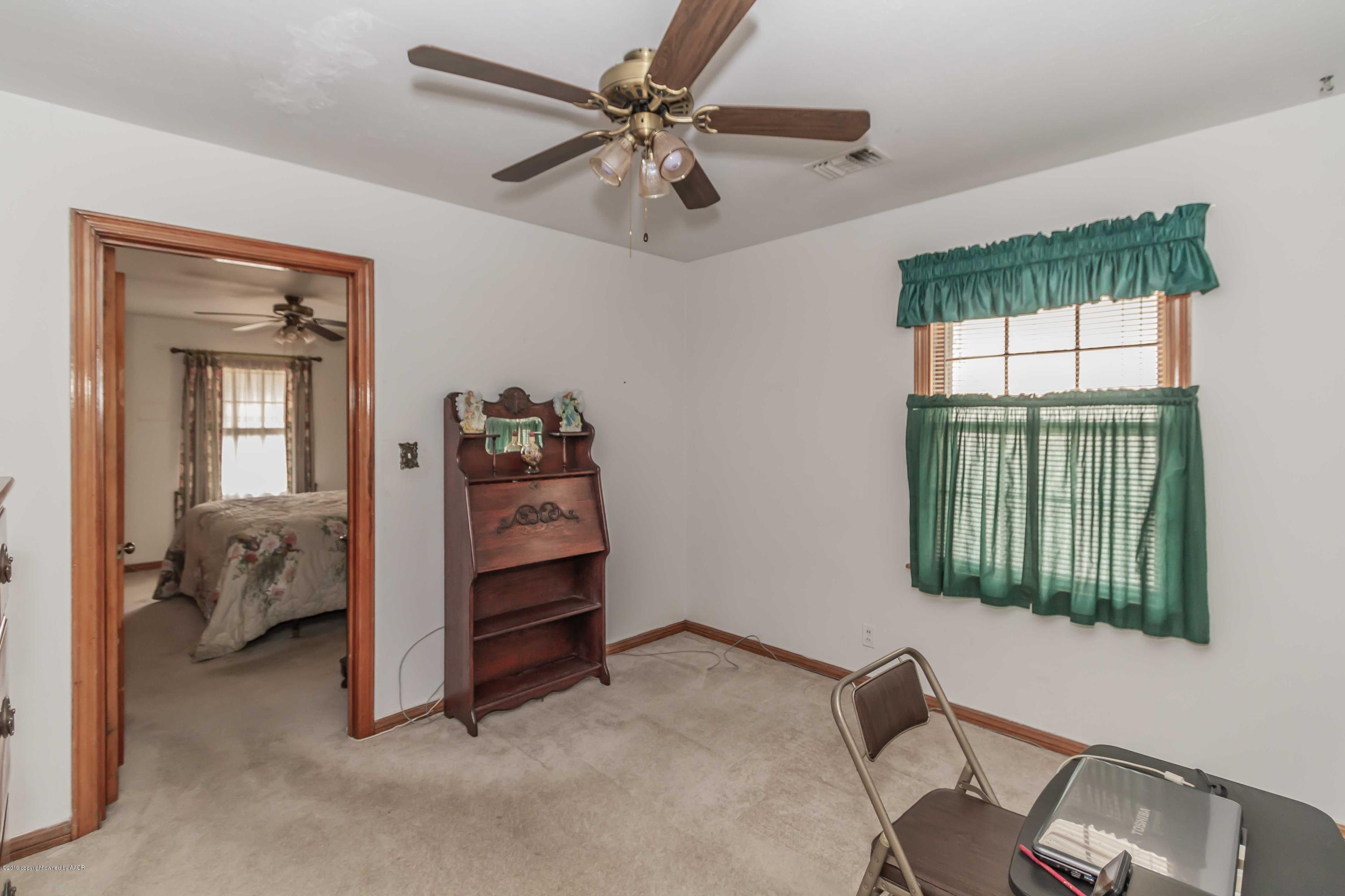 3613 Cline Road Amarillo, TX 79110 - Photo 27 of 36 a bedroom with a bed and a window