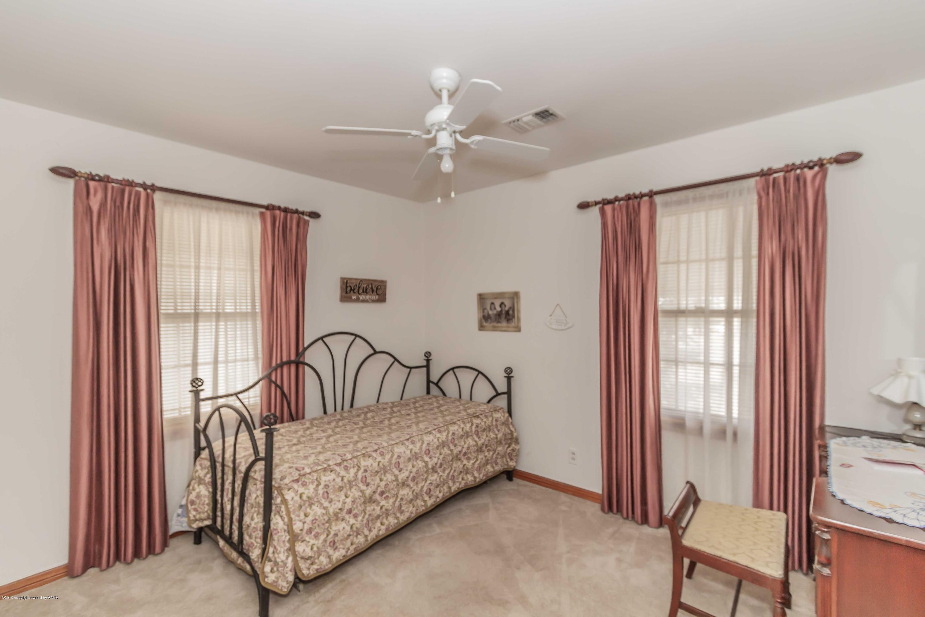 3613 Cline Road Amarillo, TX 79110 - Photo 28 of 36 a bedroom with furniture and a window