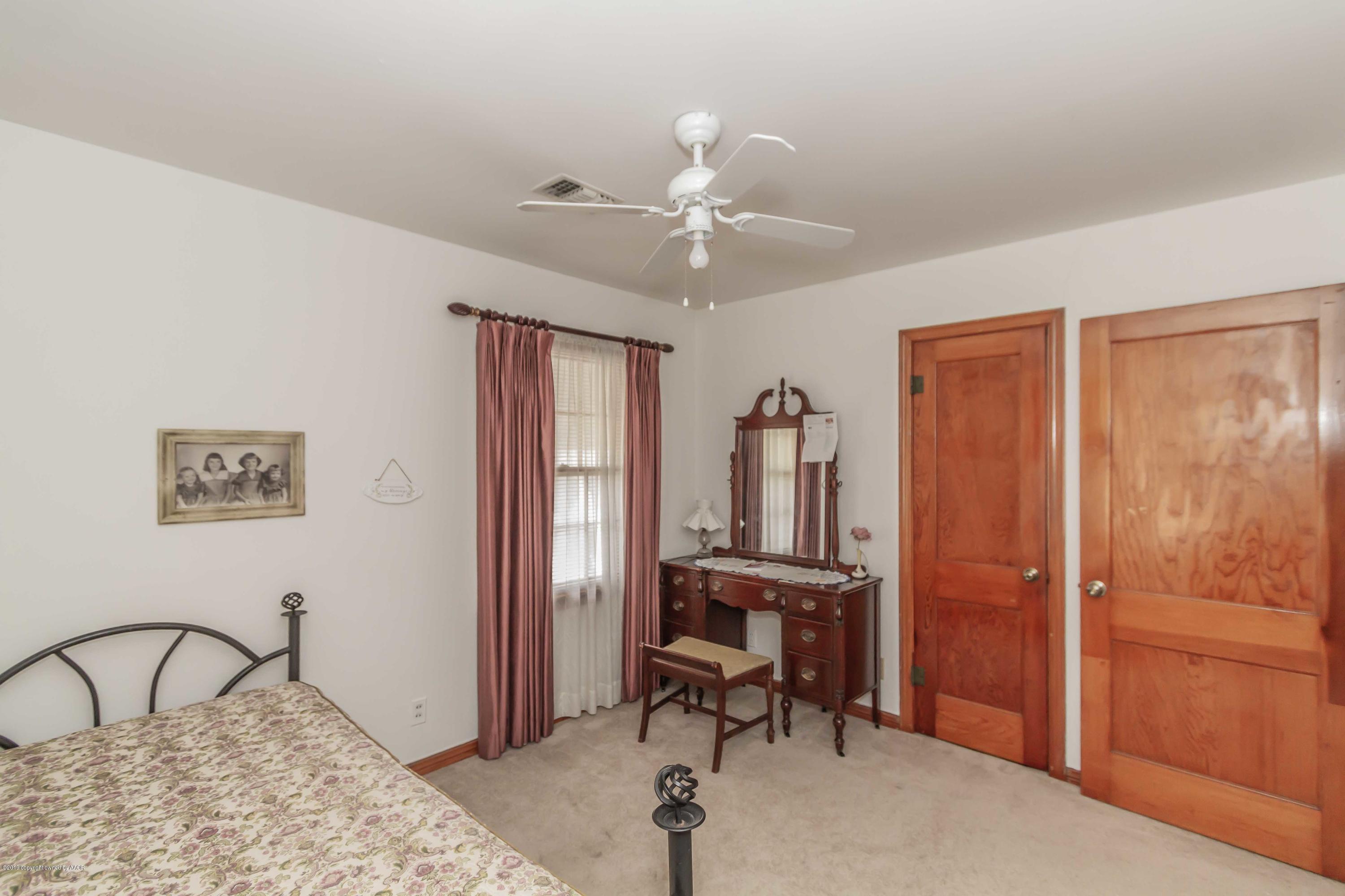 3613 Cline Road Amarillo, TX 79110 - Photo 29 of 36 a bedroom with furniture and a window