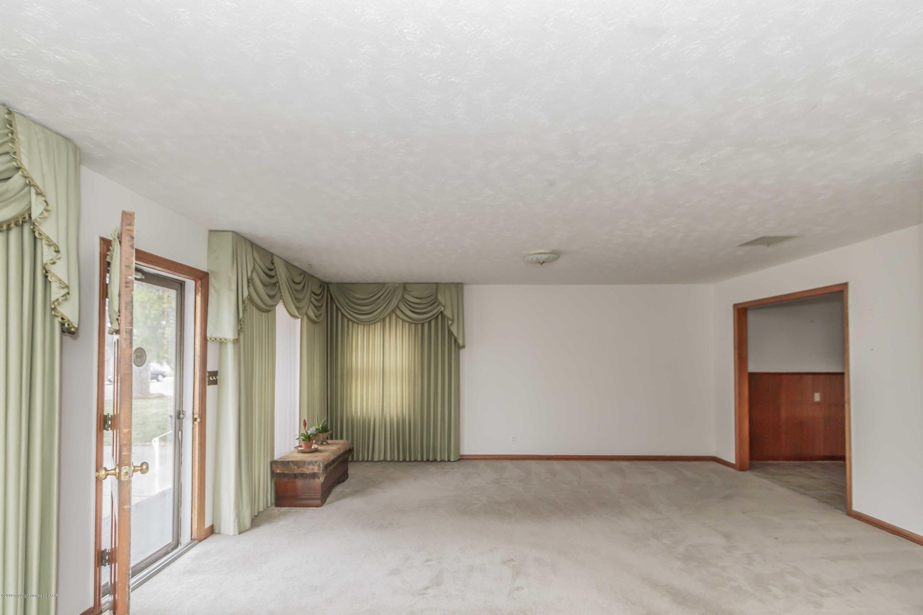 3613 Cline Road Amarillo, TX 79110 - Photo 7 of 36 a view of an empty room and a gallery