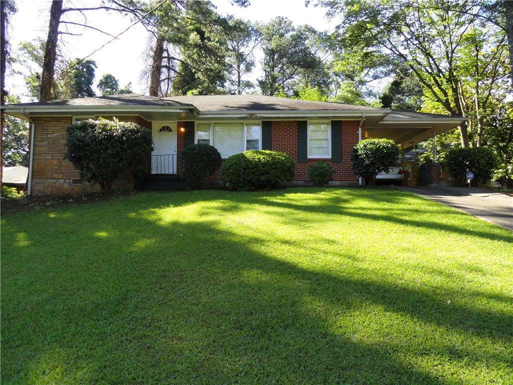 2073 Mark Trail Decatur, GA 30032 - Photo 1 of 1 a view of a house with a yard deck and a tree