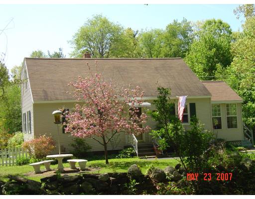 20 J Davis Road Charlton, MA 01507 - Photo 1 of 14 front view of house with a yard