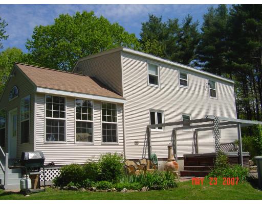 20 J Davis Road Charlton, MA 01507 - Photo 3 of 14 a view of a house with backyard and garden