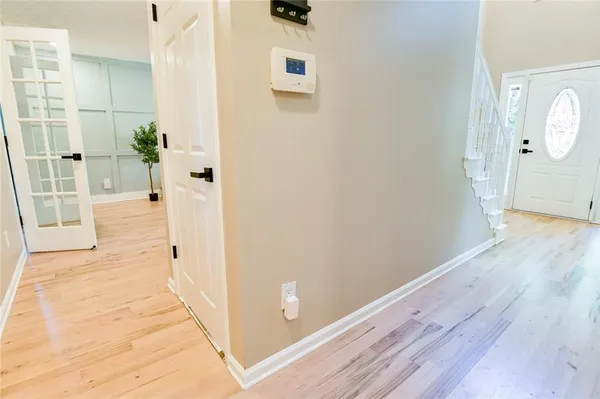 a bedroom with a bed and potted plant