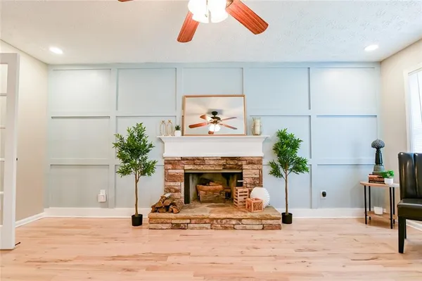 a view of an entryway with wooden floor
