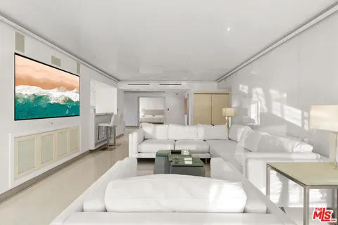 a living room with furniture large window and a flat screen tv