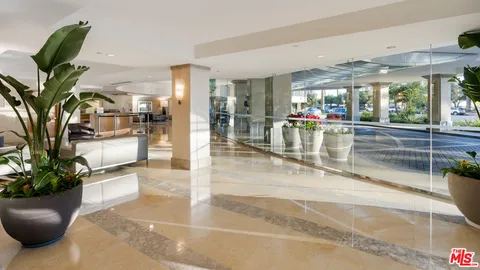 a view of a lobby with furniture and floor to ceiling window