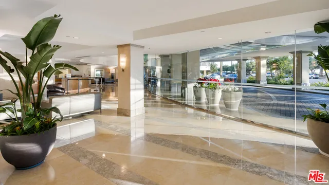 a view of a lobby with furniture and floor to ceiling window