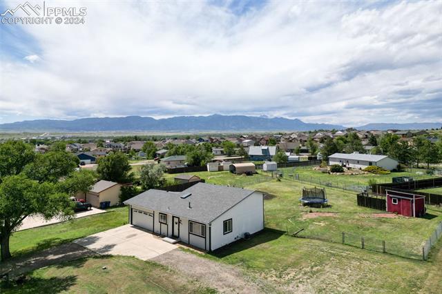 10840 Falling Star Road Fountain, CO 80817 - Photo 3 of 12 Very nice large lot with a storage shed, BBQ pit and is fully fenced.