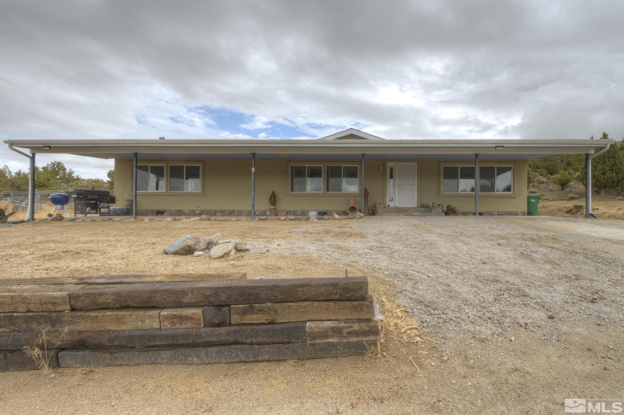 1271 Deerlodge Road Reno, NV 89508 - Photo 1 of 1 a view of a house with a backyard