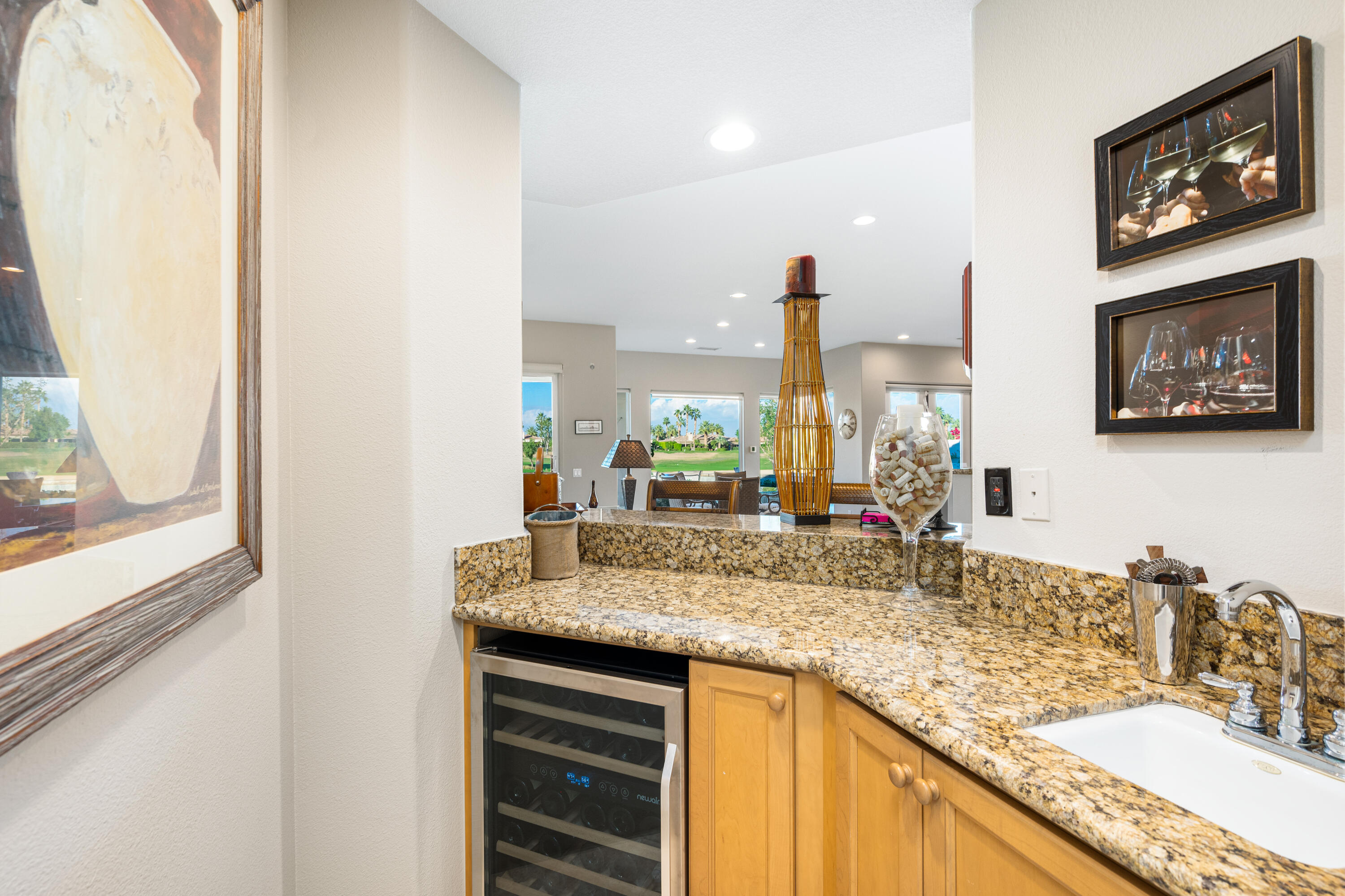 80824 Hermitage La Quinta, CA 92253 - Photo 12 of 49 a bathroom with a granite countertop sink and a large mirror next to a window
