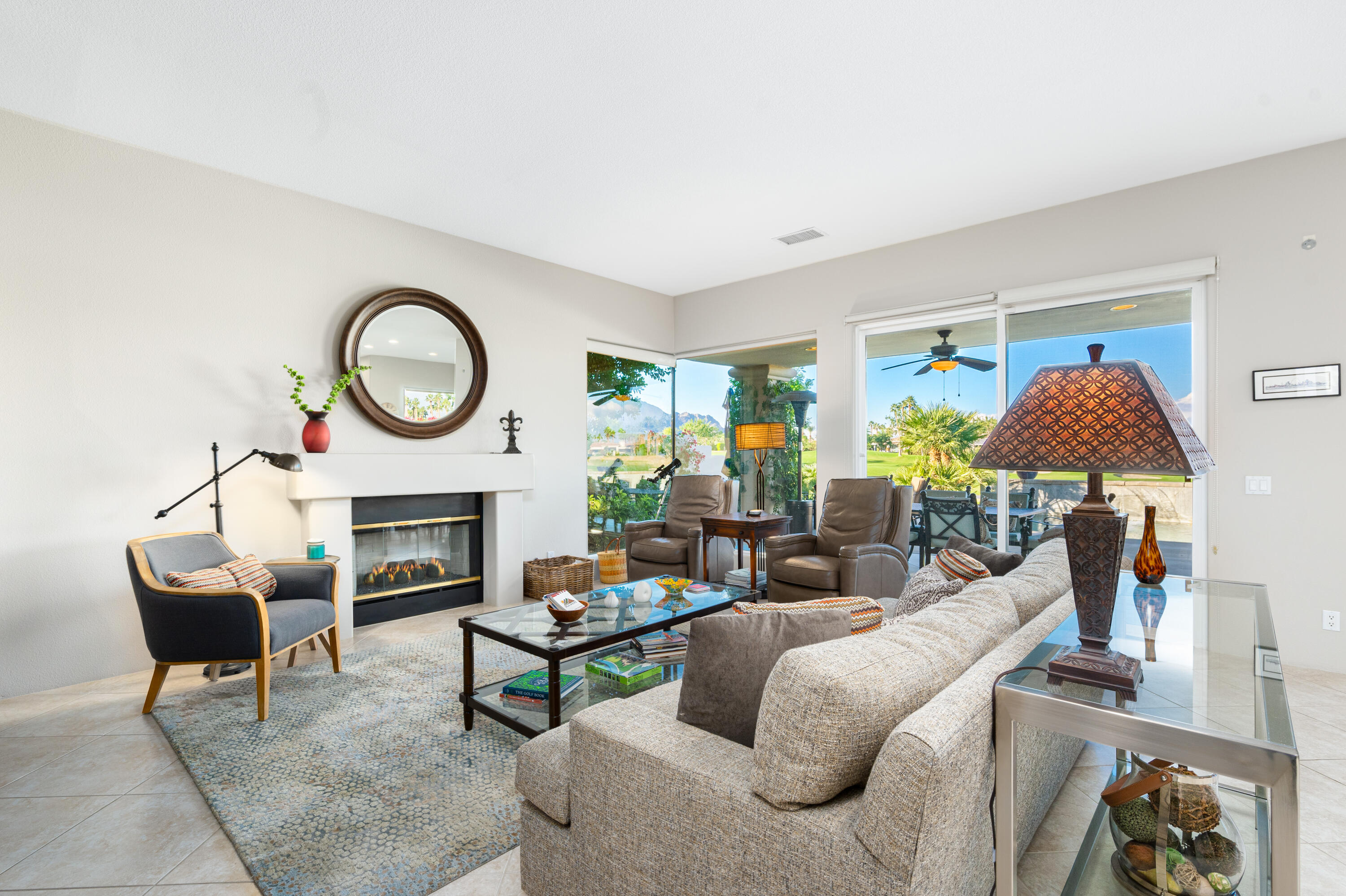 80824 Hermitage La Quinta, CA 92253 - Photo 13 of 49 a living room with furniture a rug and a fireplace