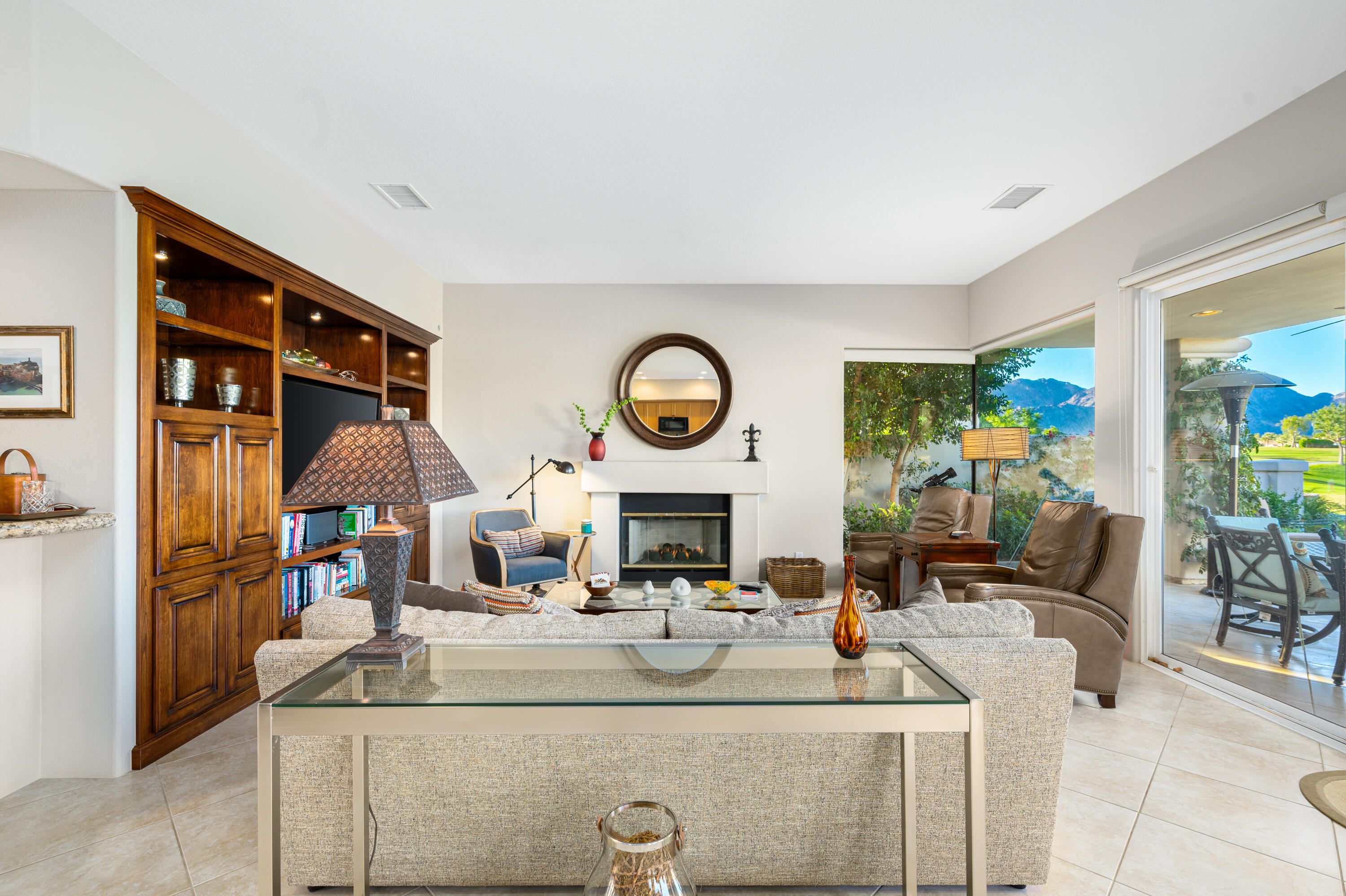 80824 Hermitage La Quinta, CA 92253 - Photo 14 of 49 a living room with fireplace furniture and a large window