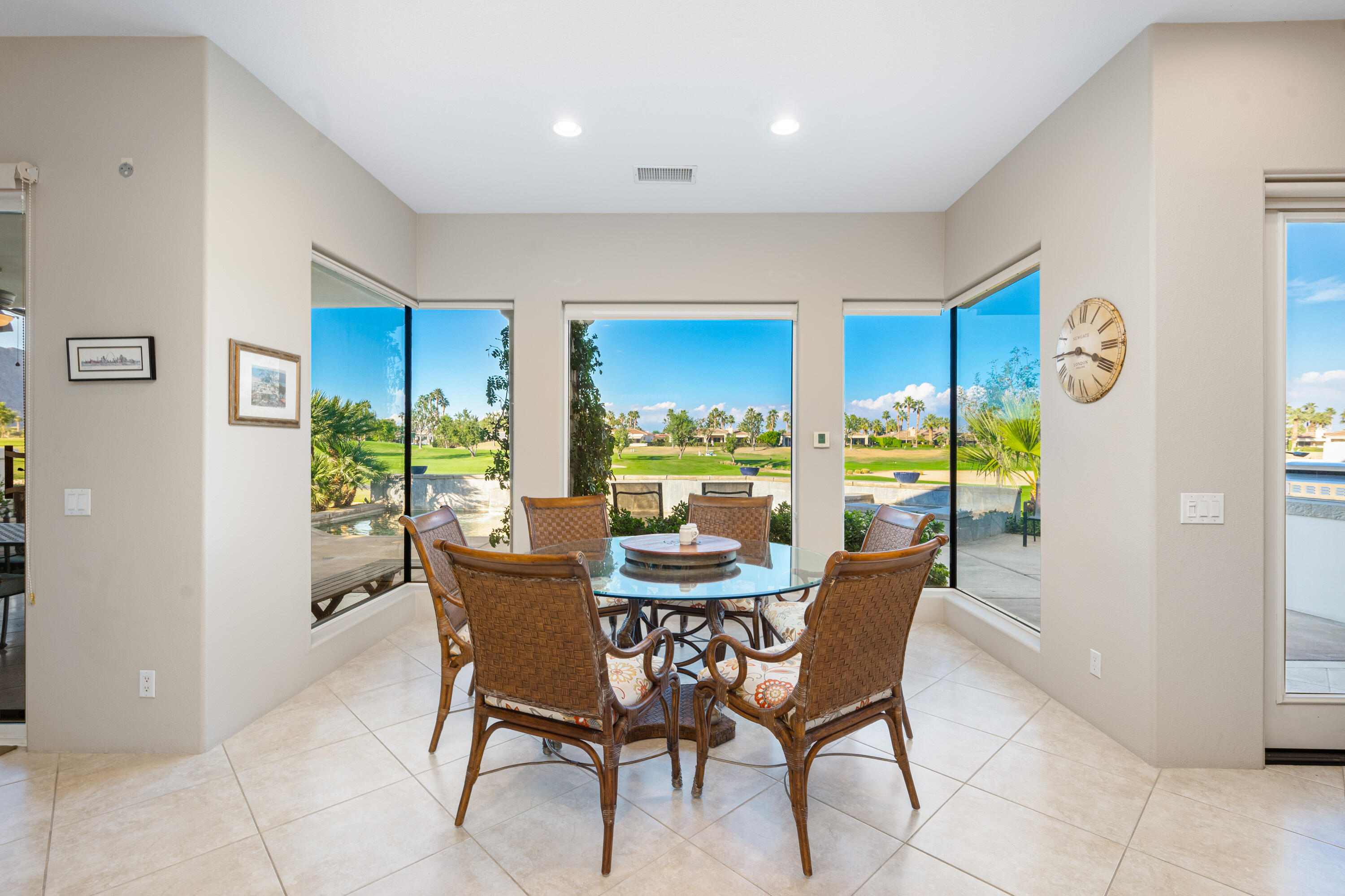80824 Hermitage La Quinta, CA 92253 - Photo 17 of 49 a dining room with furniture and a floor to ceiling window