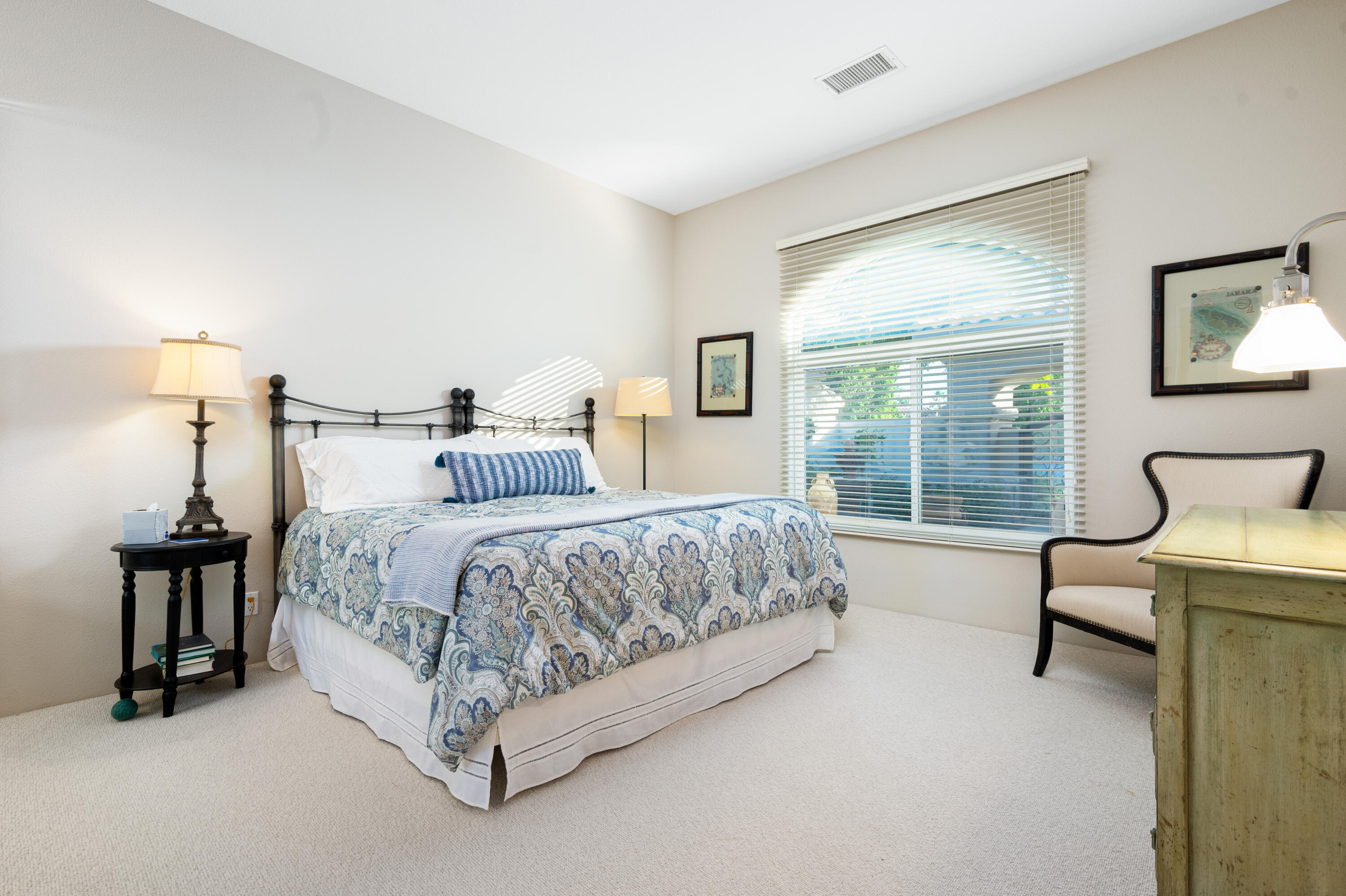 80824 Hermitage La Quinta, CA 92253 - Photo 27 of 49 a spacious bedroom with a bed and a couch
