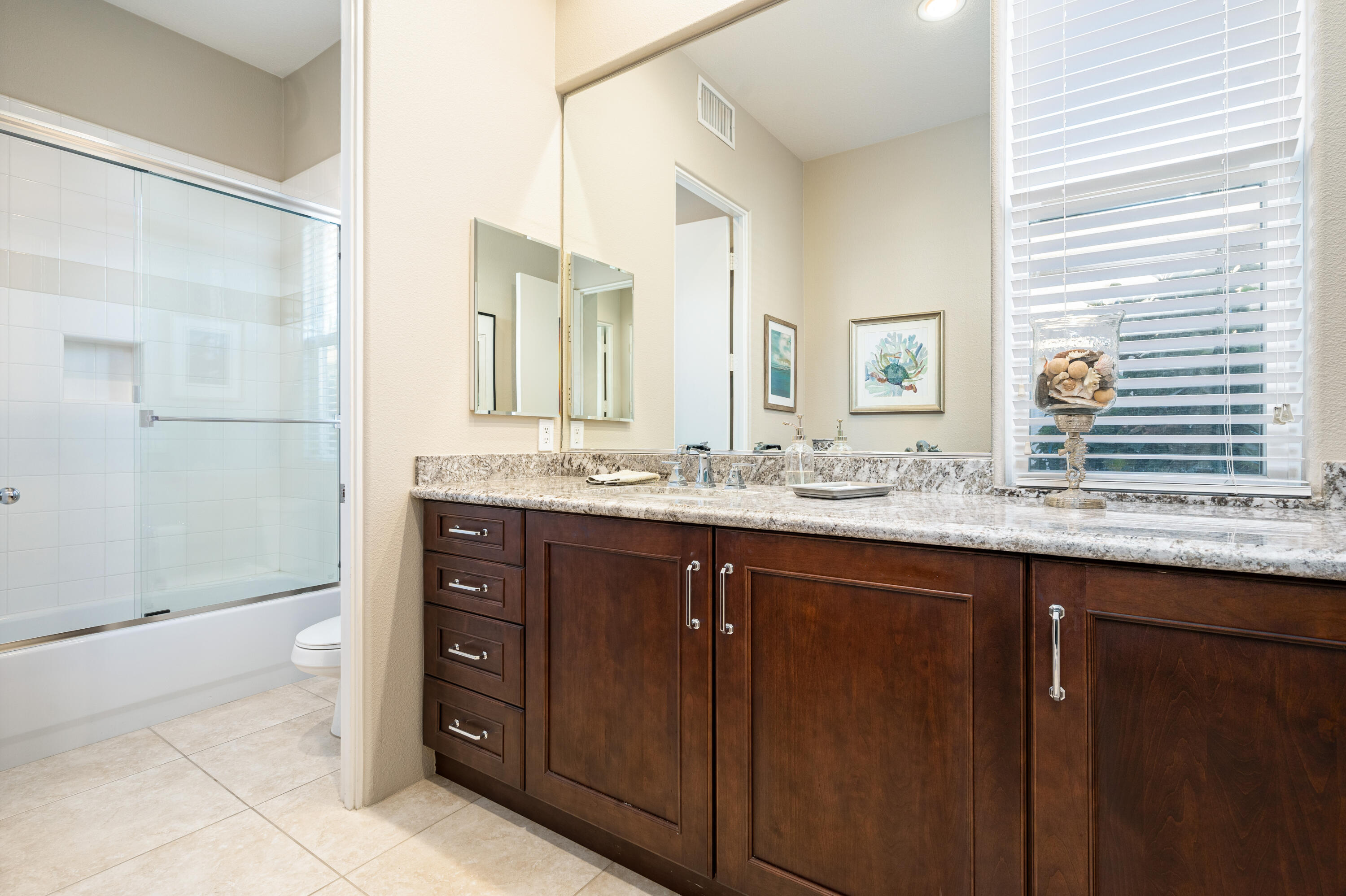 80824 Hermitage La Quinta, CA 92253 - Photo 28 of 49 a bathroom with a granite countertop sink and a mirror