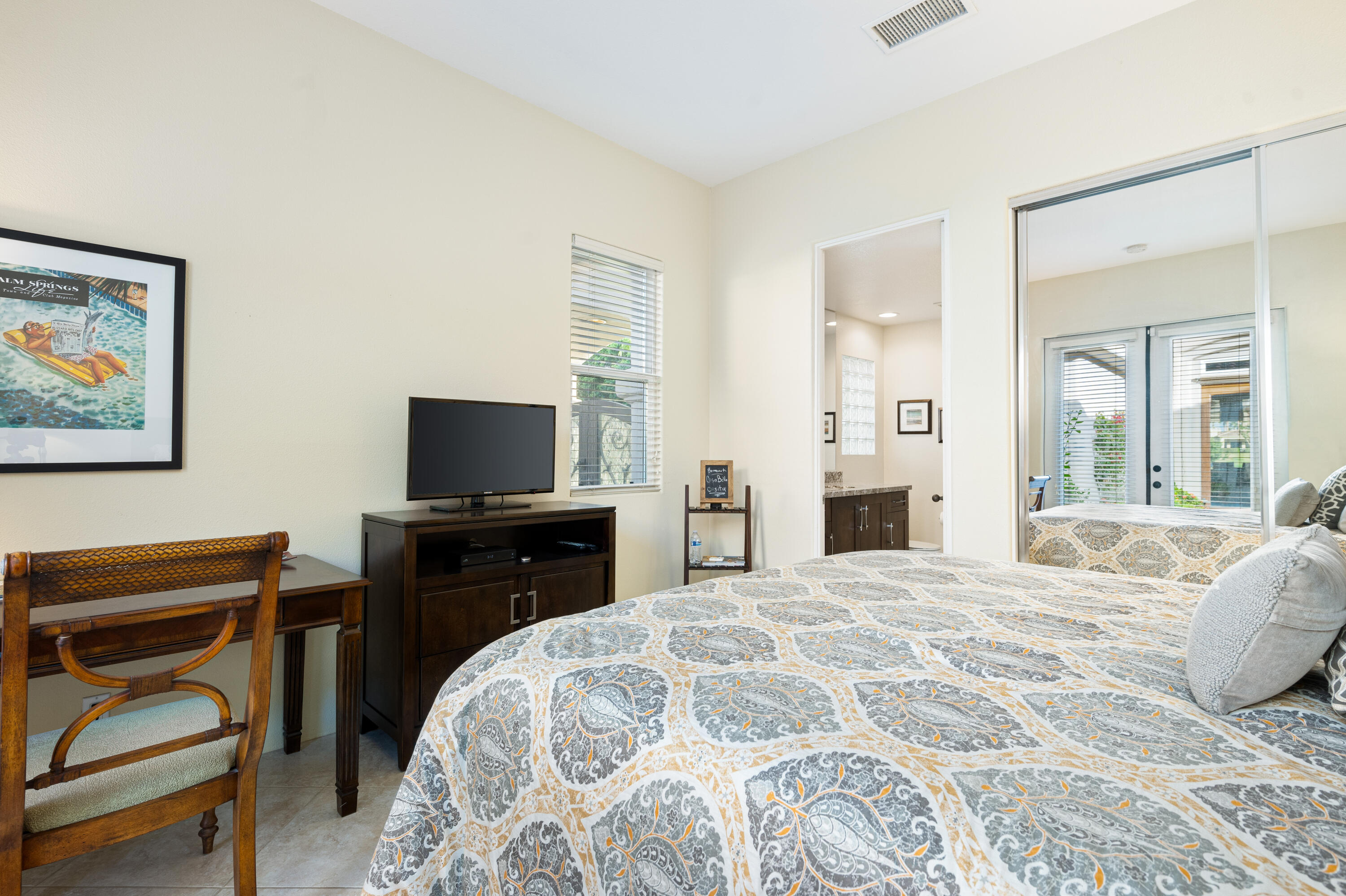 80824 Hermitage La Quinta, CA 92253 - Photo 30 of 49 a bedroom with a bed and a flat screen tv