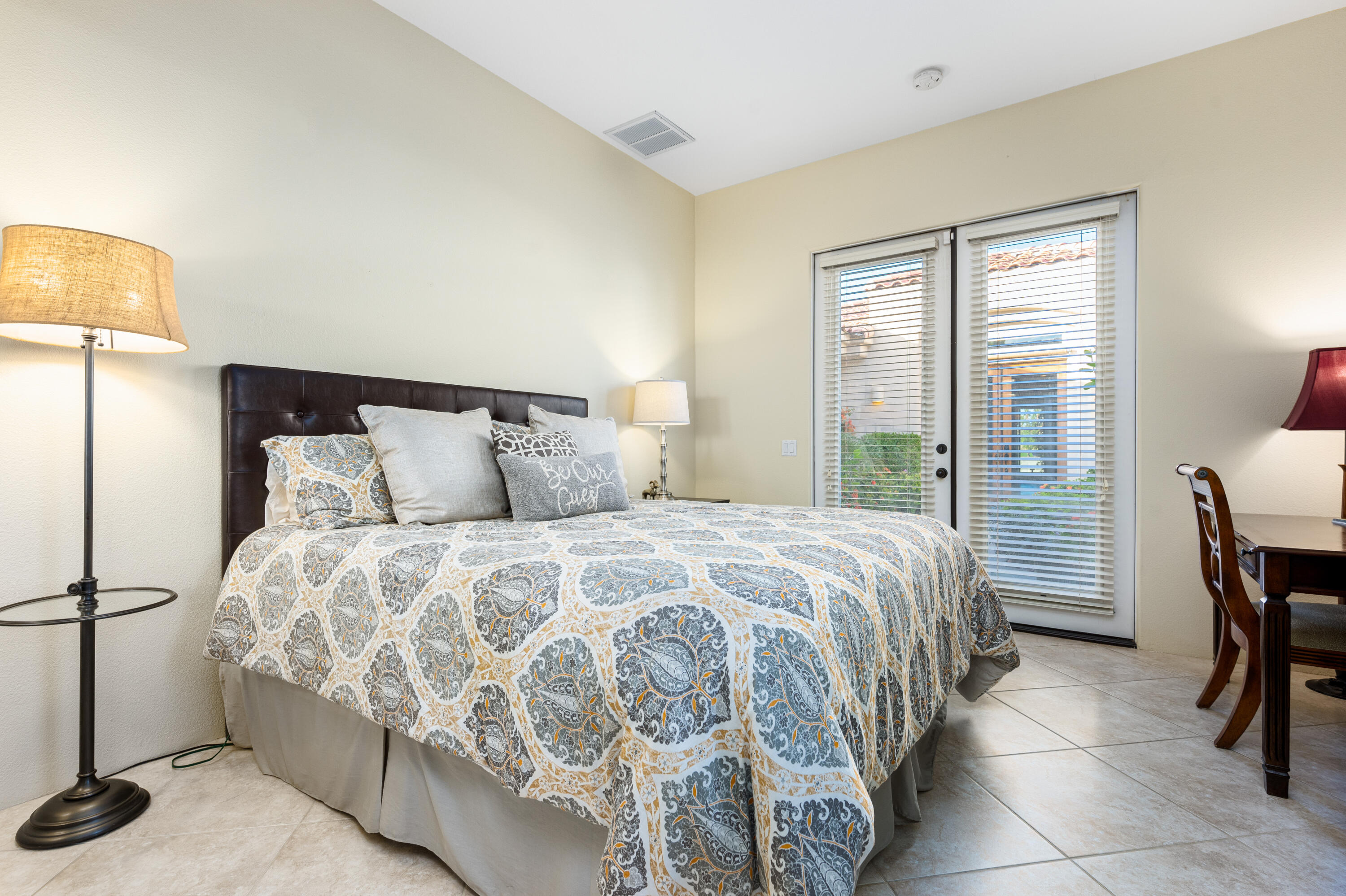 80824 Hermitage La Quinta, CA 92253 - Photo 31 of 49 a bed sitting in a bedroom next to a window