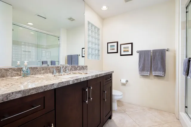 a view of a patio with a table and chairs