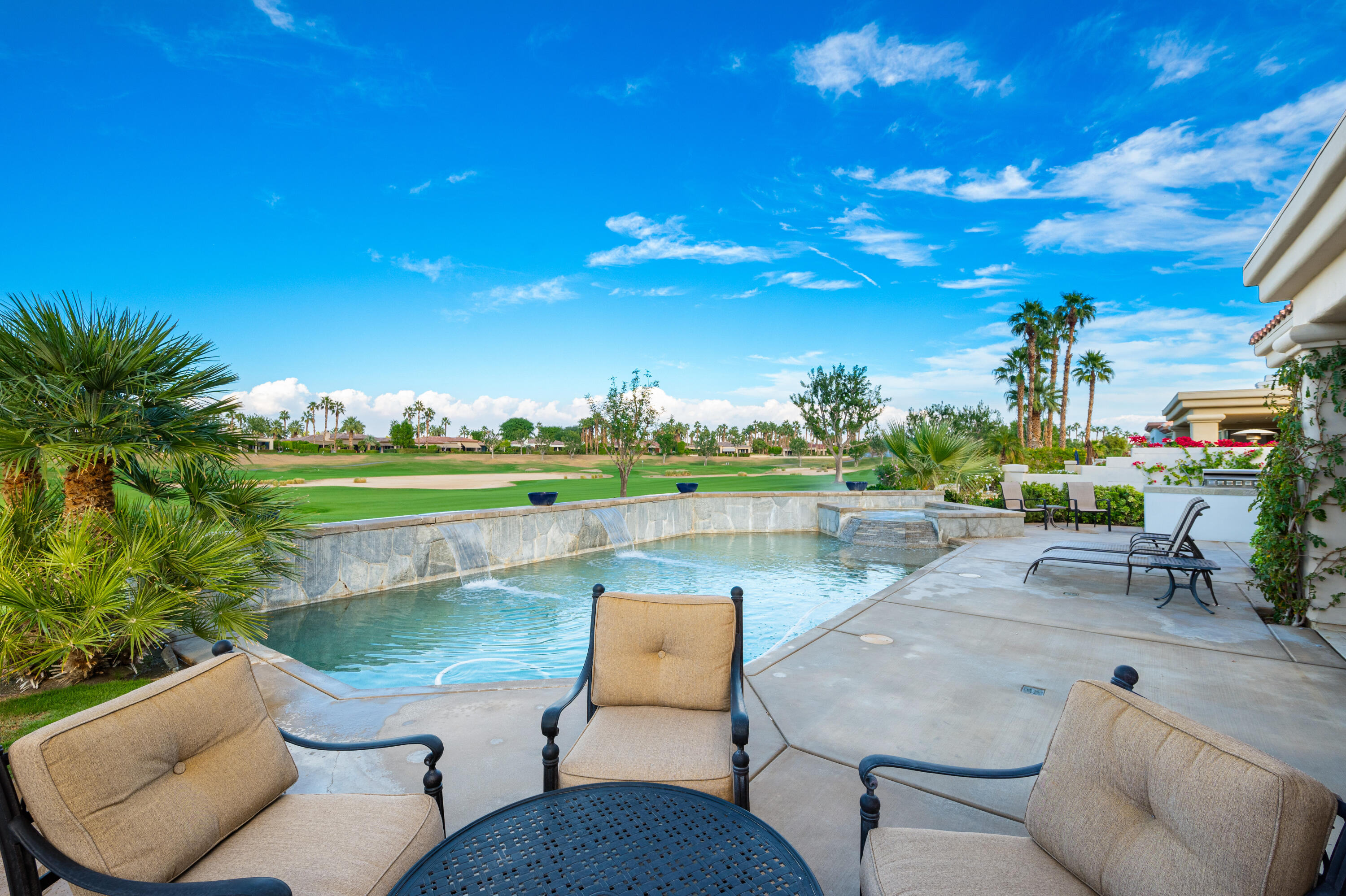 80824 Hermitage La Quinta, CA 92253 - Photo 39 of 49 a view of a swimming pool and lounge chairs