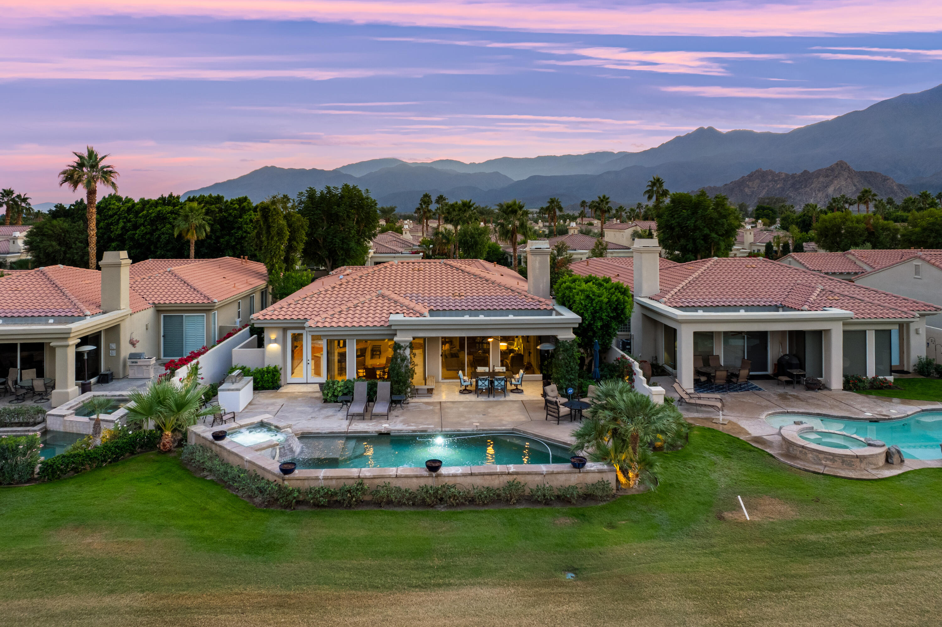 80824 Hermitage La Quinta, CA 92253 - Photo 44 of 49 a front view of a house with a garden and a yard