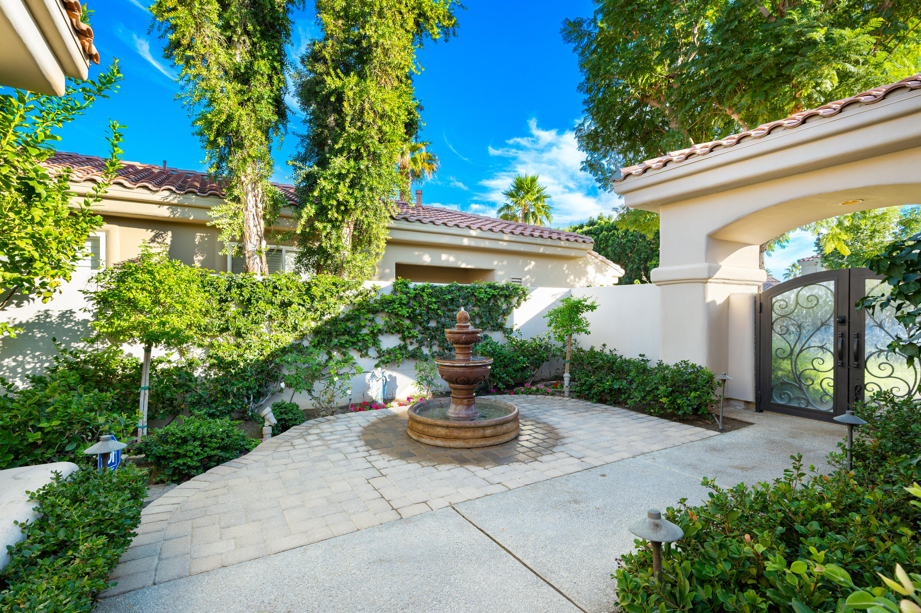 80824 Hermitage La Quinta, CA 92253 - Photo 7 of 49 a view of a house with a yard and potted plants