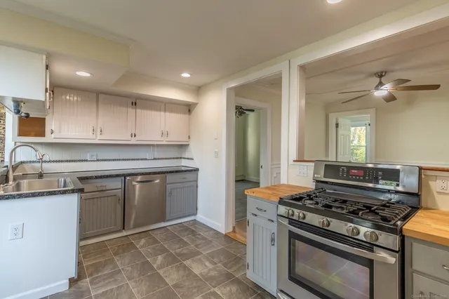 a kitchen with a stove and a sink