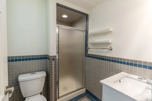 a bathroom with a toilet and a sink