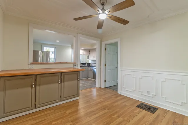a view of a kitchen cabinets and wooden floor