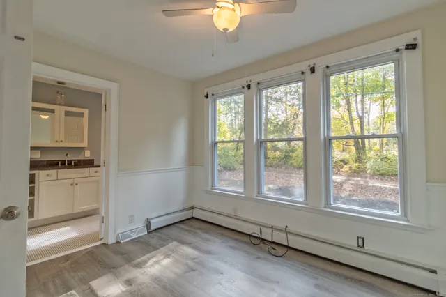 a view of an empty room with a window