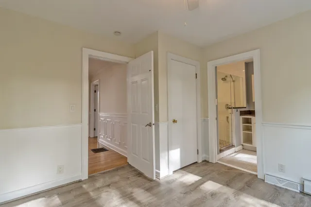 a view of a hallway with closet area