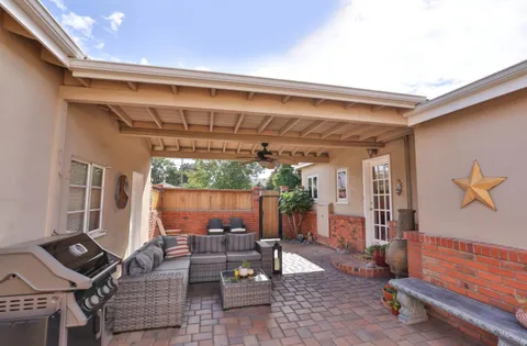 a view of patio with chairs and a potted plant