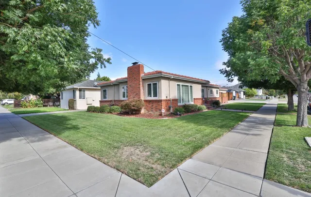 a front view of a house with a yard