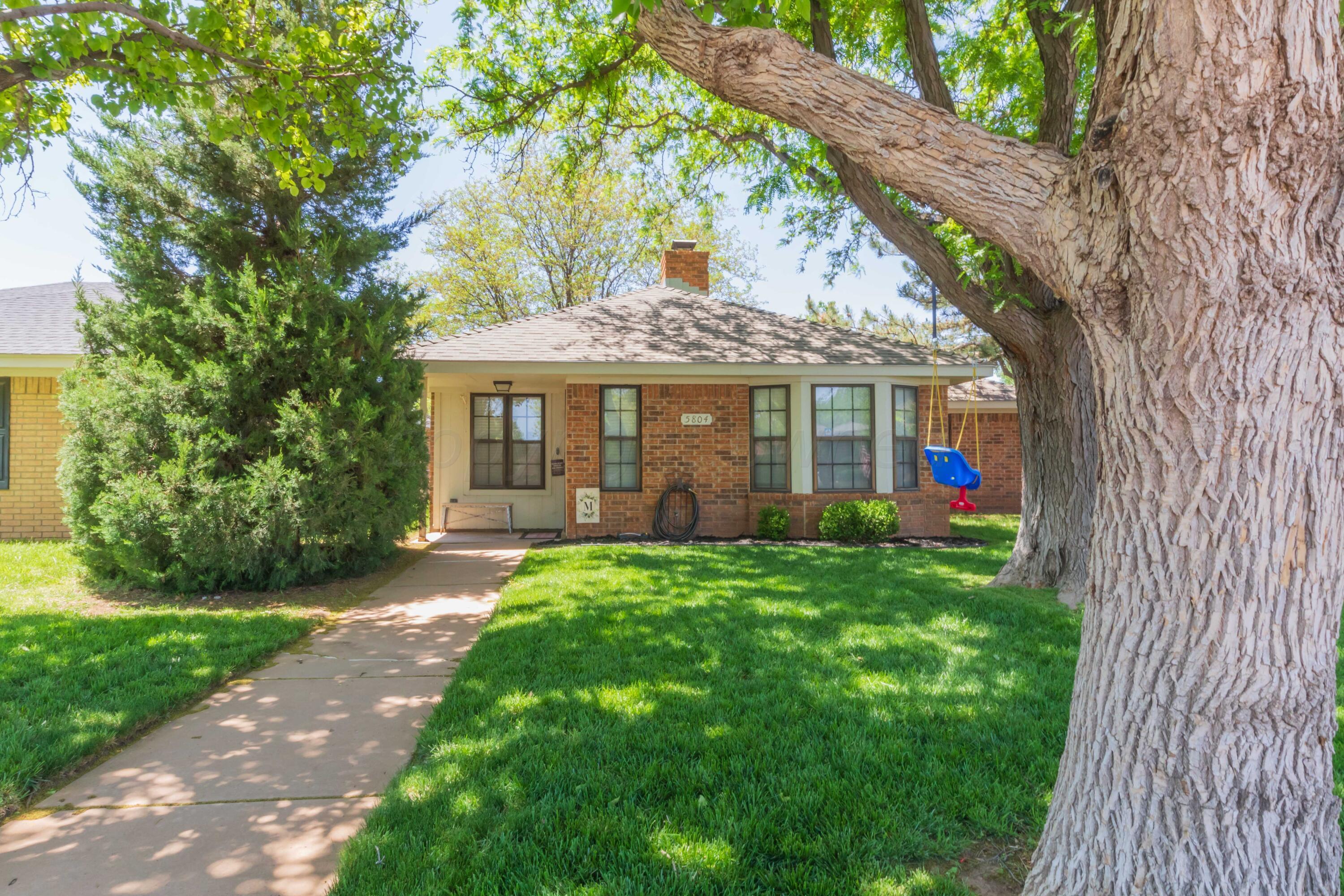 5804 Oakman Drive Amarillo, TX 79109 - Photo 1 of 48 front view of a house with a yard