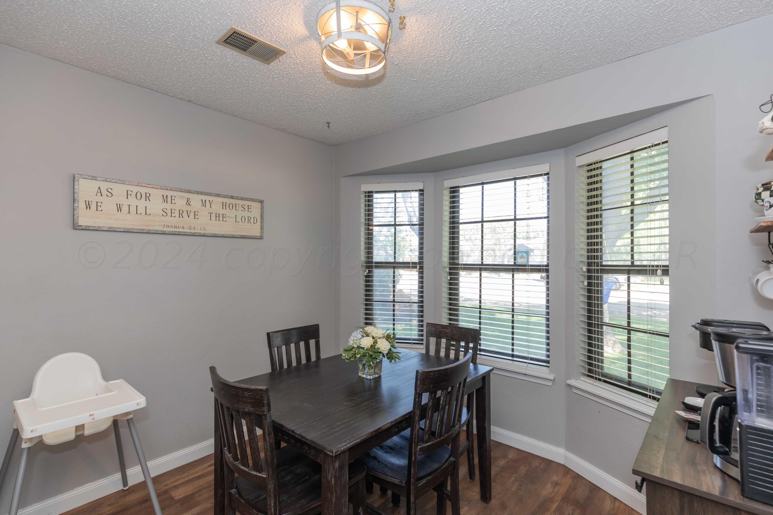 5804 Oakman Drive Amarillo, TX 79109 - Photo 11 of 48 a view of a dining room with furniture window and outside view