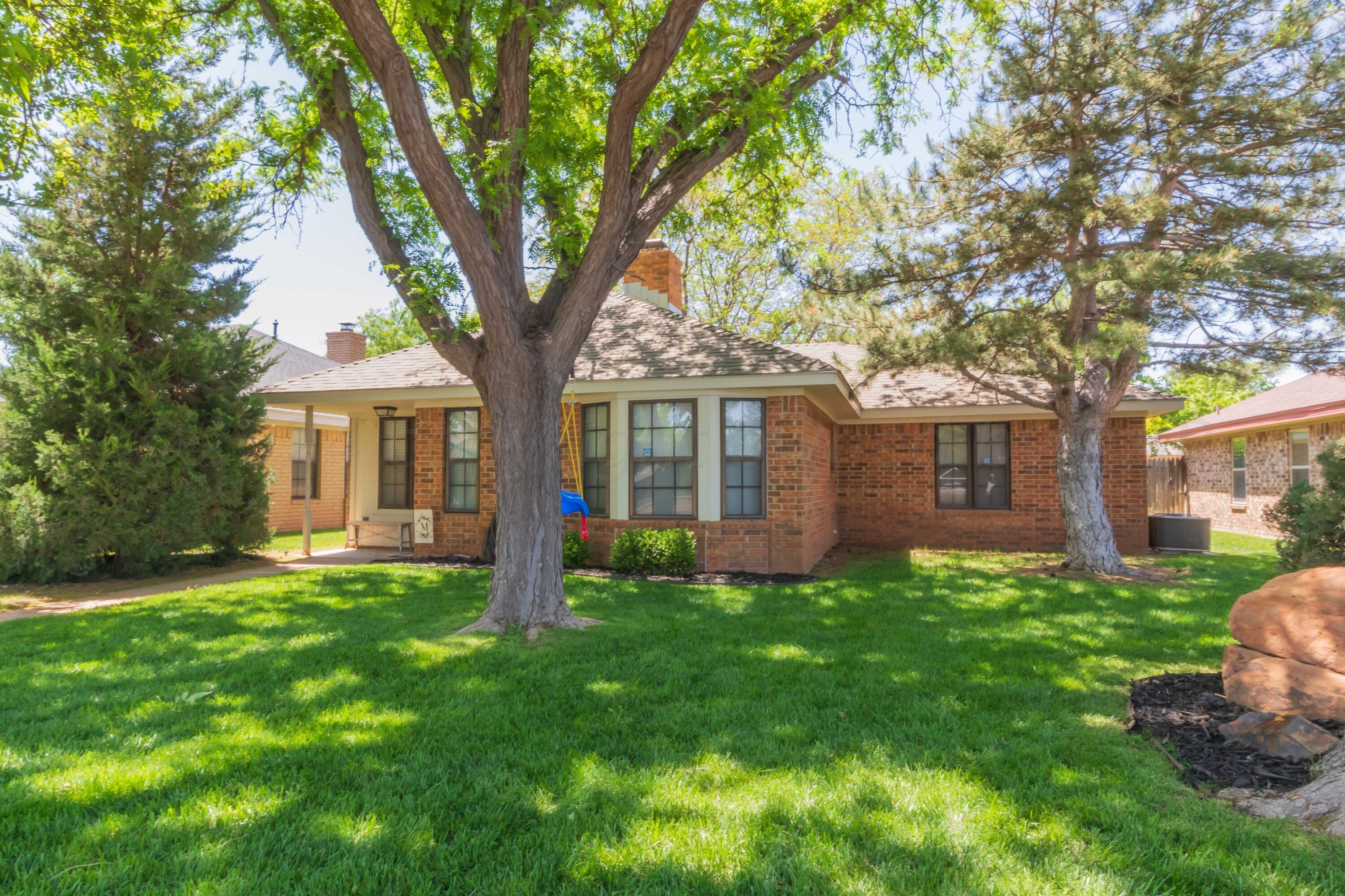 5804 Oakman Drive Amarillo, TX 79109 - Photo 2 of 48 a view of a house with a yard and pathway