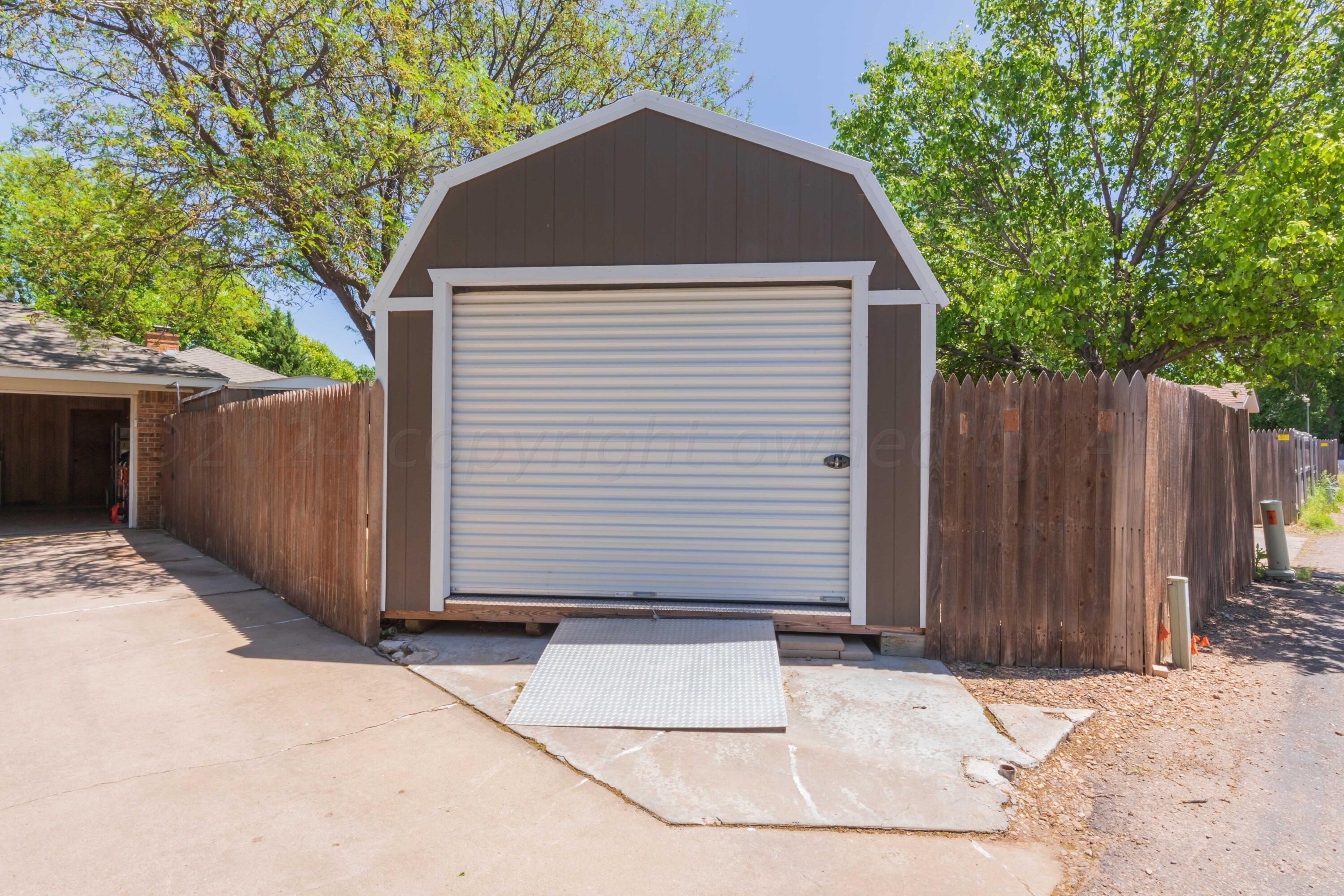 5804 Oakman Drive Amarillo, TX 79109 - Photo 23 of 48 a front view of house with wooden fence