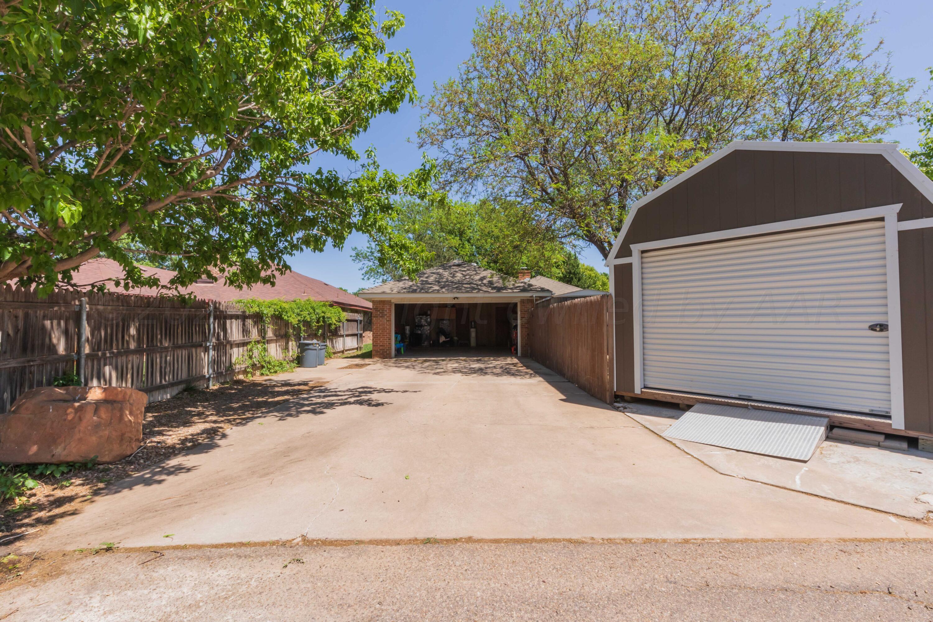 5804 Oakman Drive Amarillo, TX 79109 - Photo 24 of 48 a house with a tree in front of it