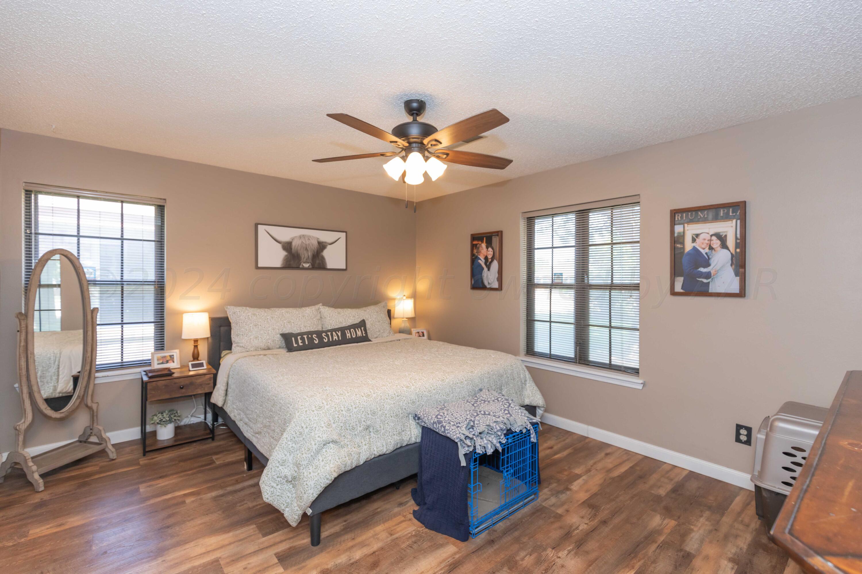 5804 Oakman Drive Amarillo, TX 79109 - Photo 28 of 48 a bedroom with a bed and window
