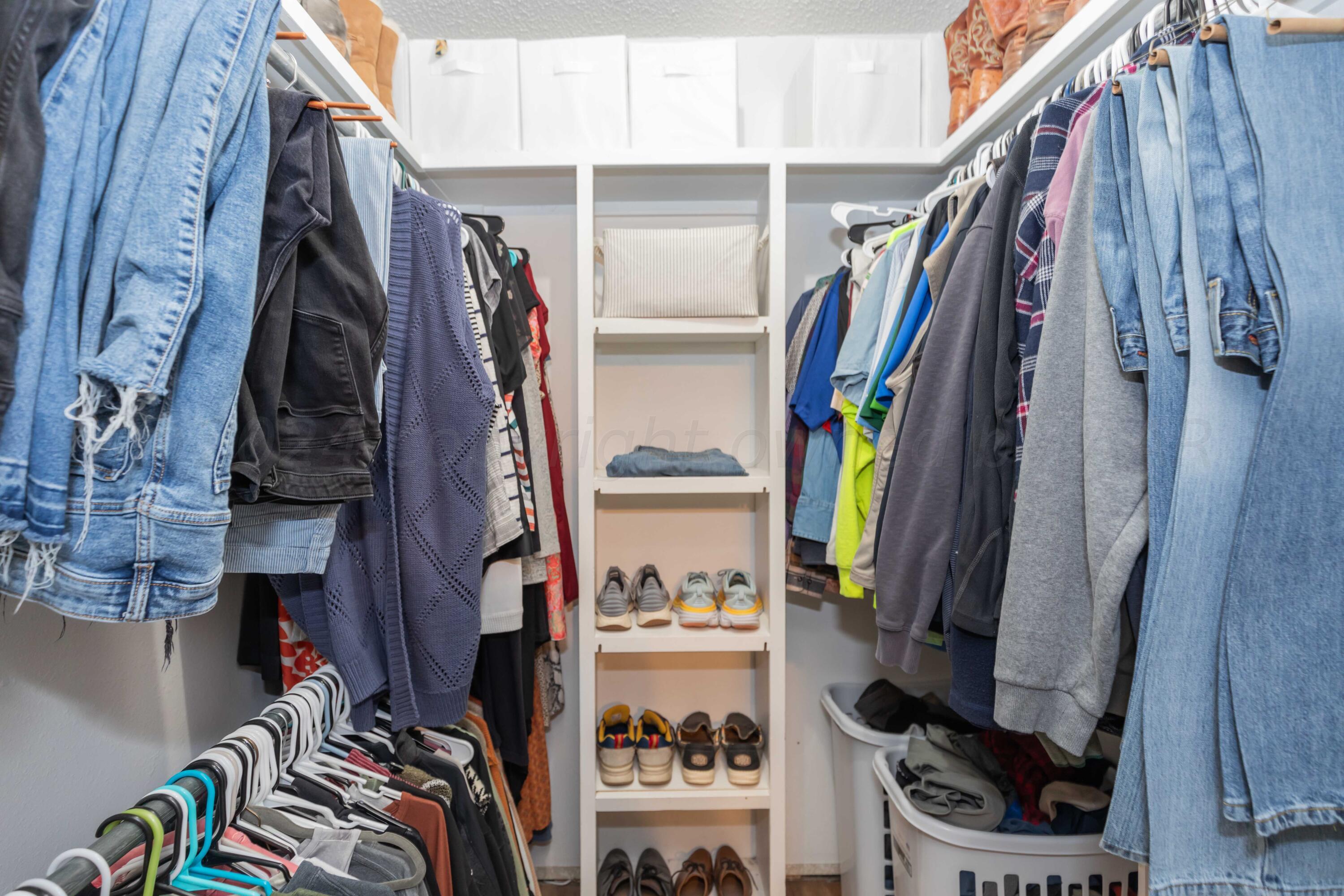 5804 Oakman Drive Amarillo, TX 79109 - Photo 32 of 48 a view of walk in closet with clothes and shoes