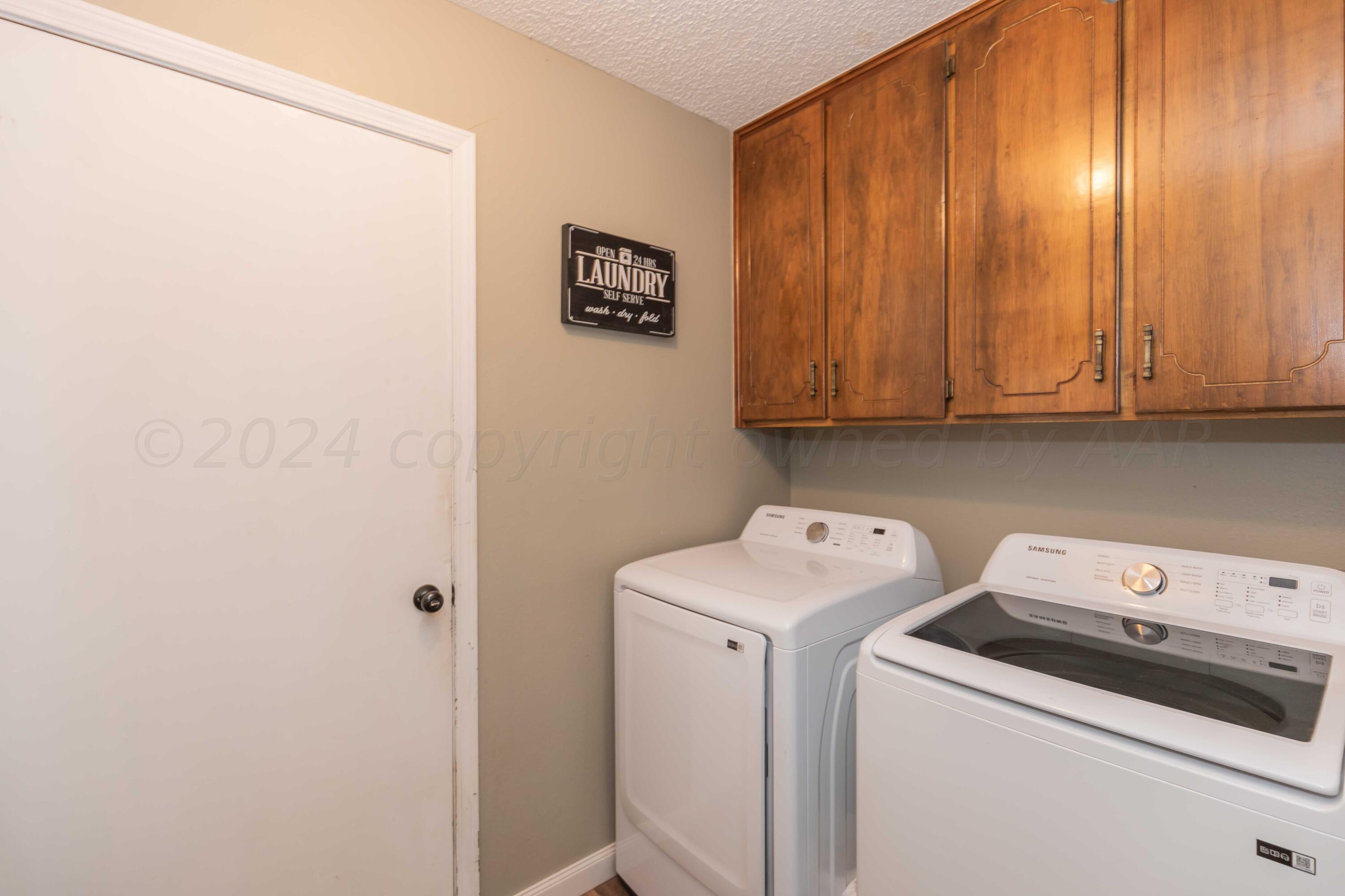 5804 Oakman Drive Amarillo, TX 79109 - Photo 43 of 48 a view of storage and utility room with washer and dryer