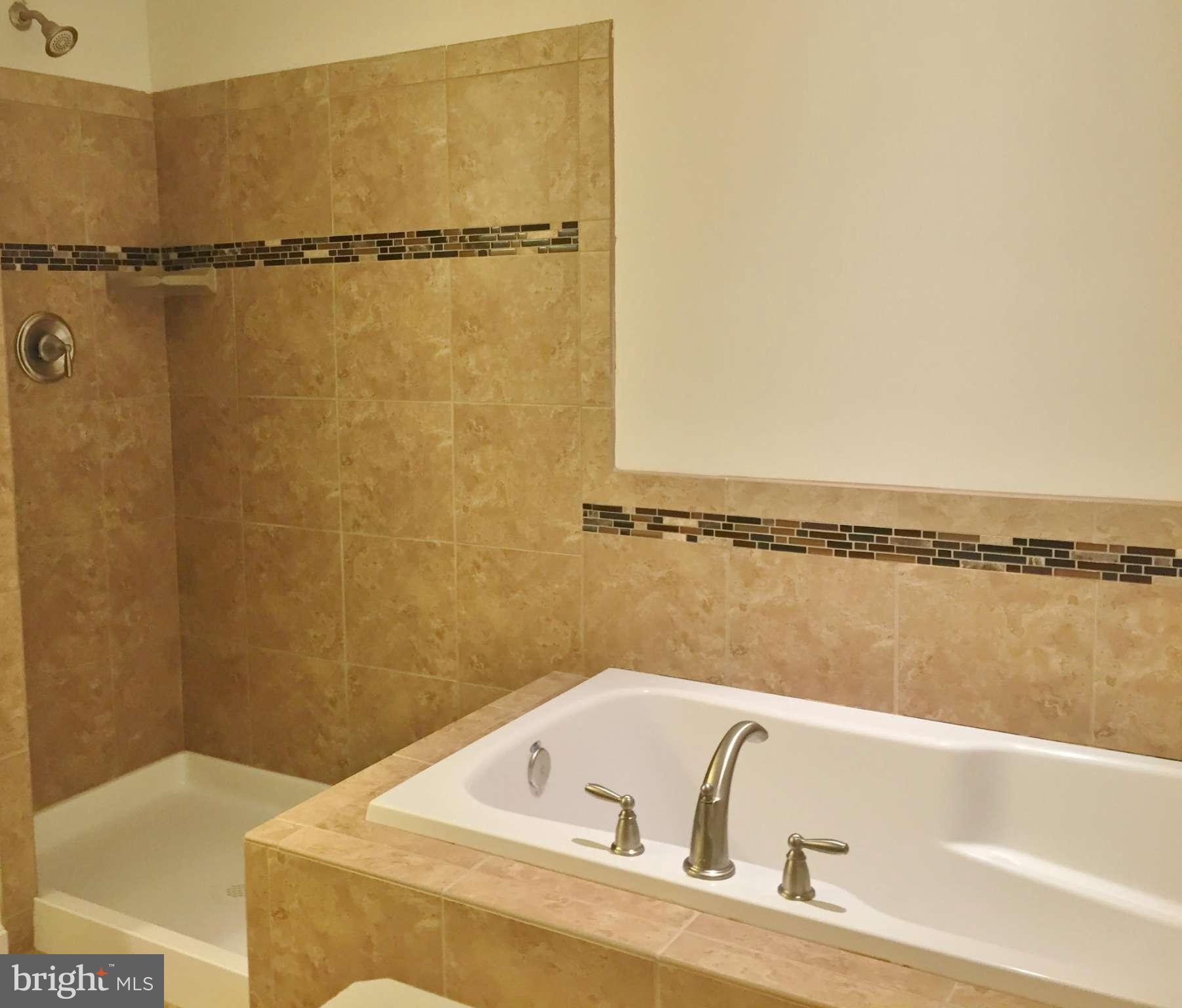 1805 Van Bibber Road Edgewood, MD 21040 - Photo 16 of 30 a bathroom with a bathtub and shower