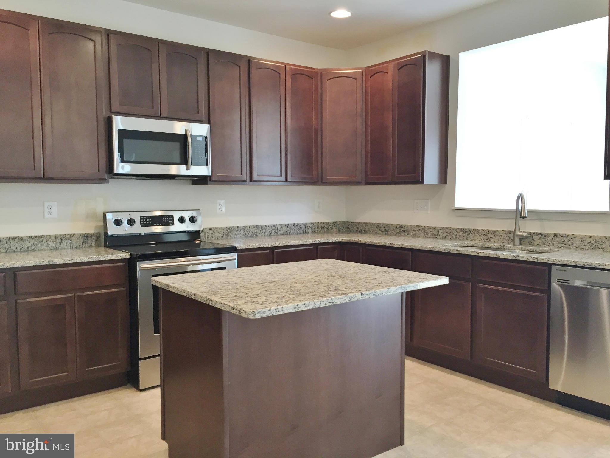 1805 Van Bibber Road Edgewood, MD 21040 - Photo 7 of 30 a kitchen with a sink a microwave and cabinets